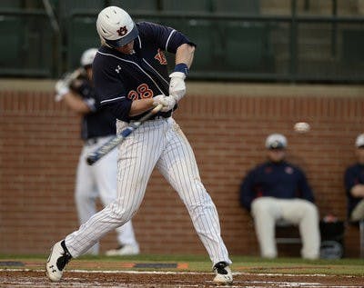 Auburn's Garrett Cooper hits a home run in the 4th inning. (Courtesy of Todd Van Emst / AUBURN ATHLETICS PHOTOGRAPHER)