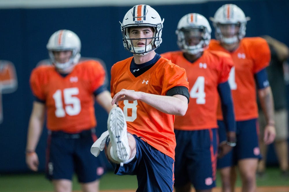 Jarrett Stidham (8) warms up&nbsp;at Auburn's football practice on Thursday, March 29, 2018, in Auburn, Ala.