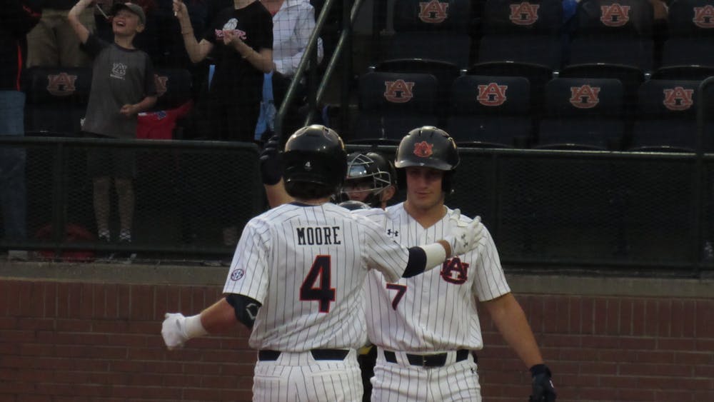 <p>Teammates Brody Moore (4) and Cole Foster (7) against Kennesaw State on April 20, 2022 at Plainsman Park in Auburn, Ala.</p>