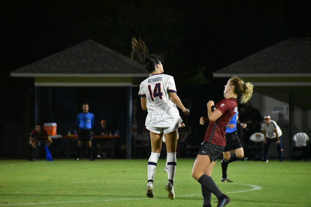 <p>Oct. 21, 2021; Auburn, AL, USA; Sydney Richards (14) heads a ball while on the attack in a match between Arkansas and Auburn at the Auburn Soccer Complex.</p>