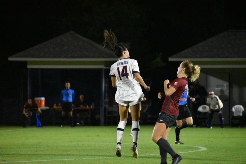 Oct. 21, 2021; Auburn, AL, USA; Sydney Richards (14) heads a ball while on the attack in a match between Arkansas and Auburn at the Auburn Soccer Complex.