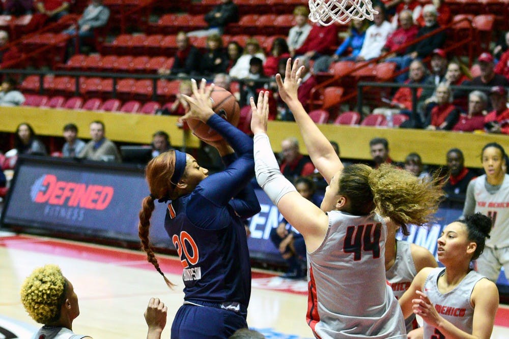 <p>Unique Thompson (20) grabs the rebound in Auburn women's basketball vs. New Mexico on Sunday, Nov. 11, 2018, in Albuquerque, N.M..</p>