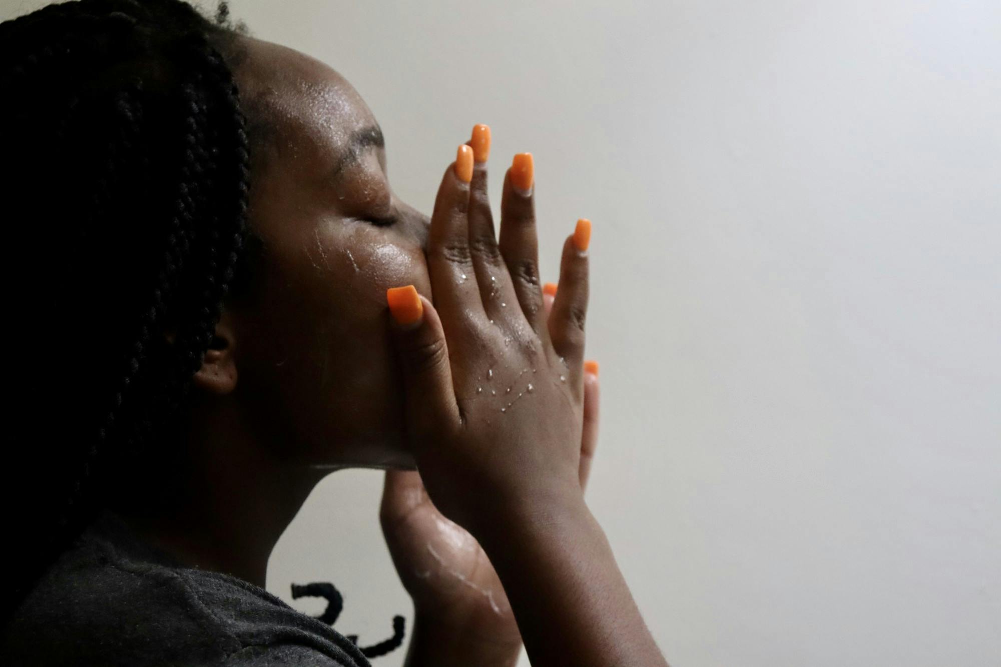 Student washing their face