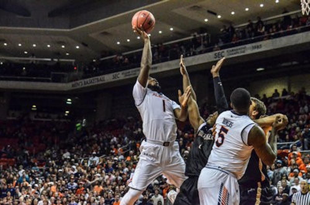 KT Harrell shoots against Milwaukee. (Raye May / Photo Editor)