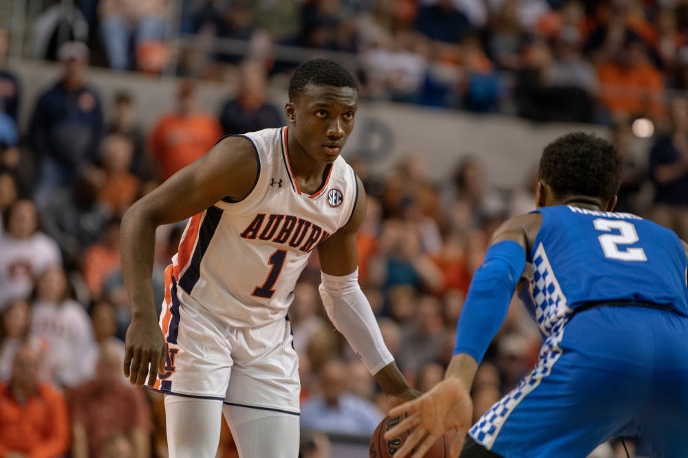 Jared Harper (1) looks for a teammate to pass to during Auburn Basketball vs. Kentucky, on Saturday, Jan. 19, 2019 in Auburn, Ala.