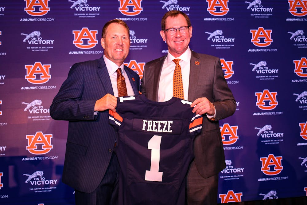<p>Auburn Athletic Director John Cohen poses with Hugh Freeze at the coaches' introduction as Auburn's head coach at the Woltosz Football Performance Center on Nov. 29, 2022.</p>