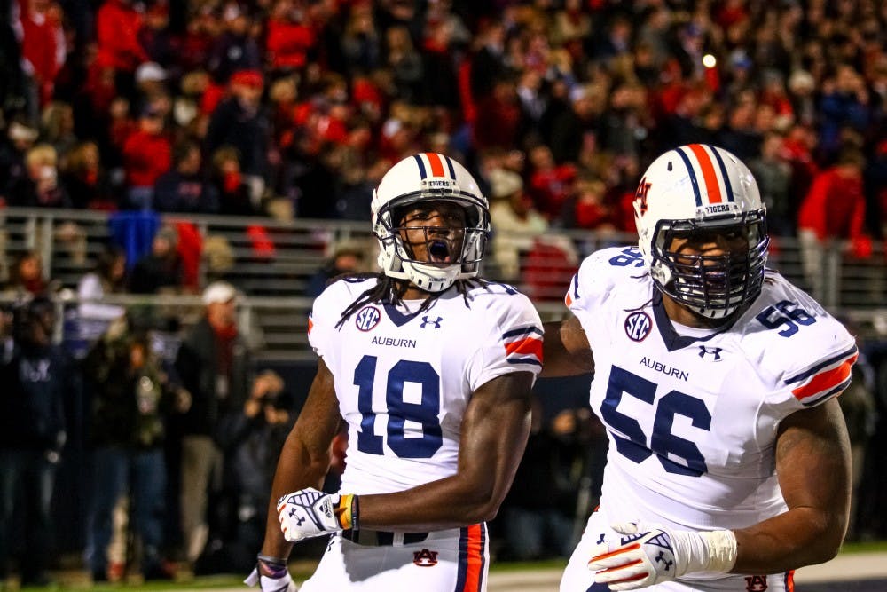 Sammie Coates celebrates with Avery Young after a touchdown. (Kenny Moss | Photographer)