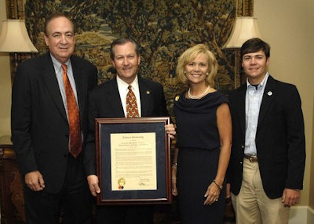 The Auburn University Board of Trustees on June 22 voted to name a new facility at the Auburn University Research Park as the Mike Hubbard Center for Advanced Science, Innovation and Commerce. From left,  Auburn President Jay Gogue; Alabama House Speaker Mike Hubbard; Hubbard's wife Susan, associate dean in Auburn's College of Human Sciences; and the Hubbards' son, Clayte.