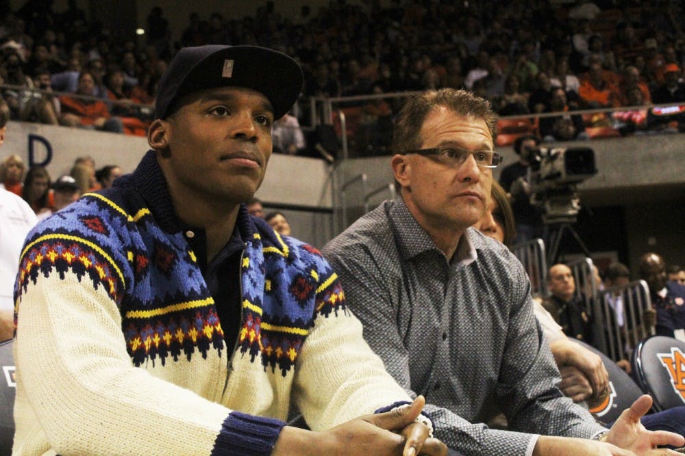 Head Coach, Gus Malzahn and former Auburn quarterback, Cam Newton, watch as Auburn takes on Alabama on February 6, 2013. (Katherine McCahey / ASSISTANT PHOTO EDITOR)