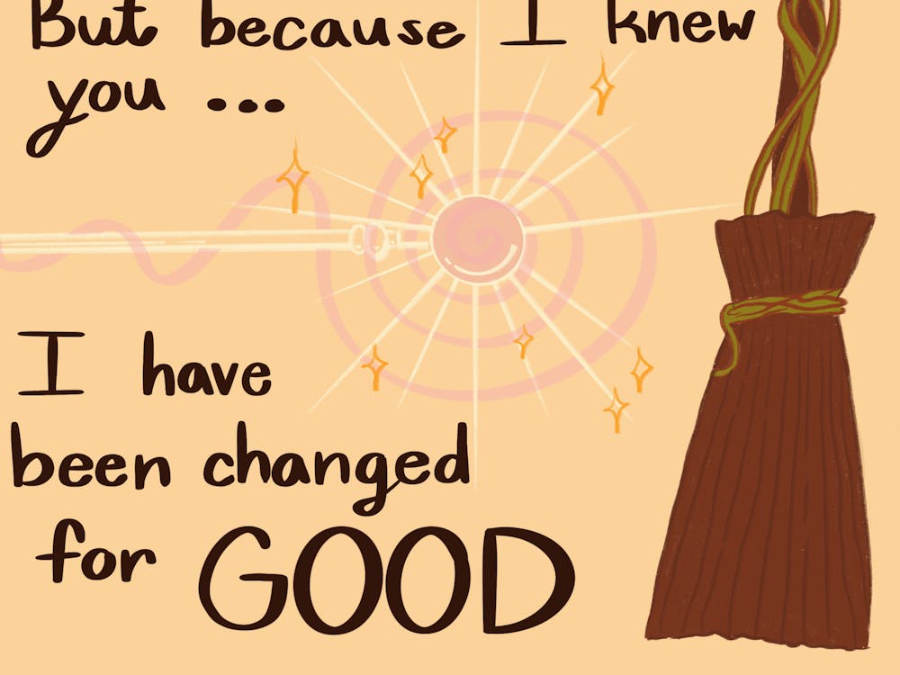 The lyrics "But because I knew you... I have been changed for GOOD" are on a light yellow background with a pink magic wand and brown broom. 