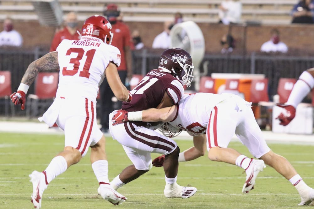 <p>Arkansas linebacker Bumper Pool tackles a Mississippi State Player. Photo via: SEC Media Portal</p>