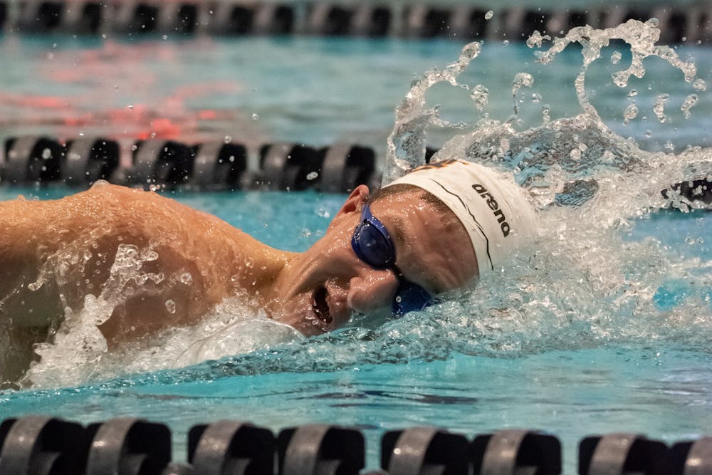 An Auburn swimmer competes in a freestyle event at the James E. Martin Aquatic Center on Feb. 4, 2023.