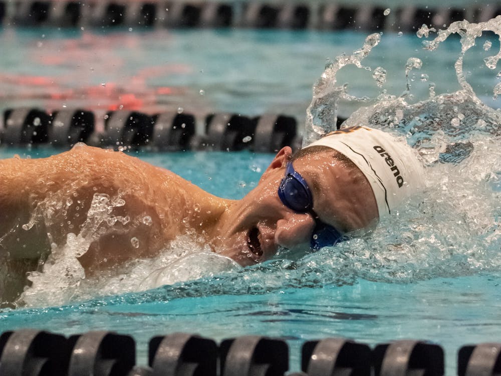 An Auburn swimmer competes in a freestyle event at the James E. Martin Aquatic Center on Feb. 4, 2023.