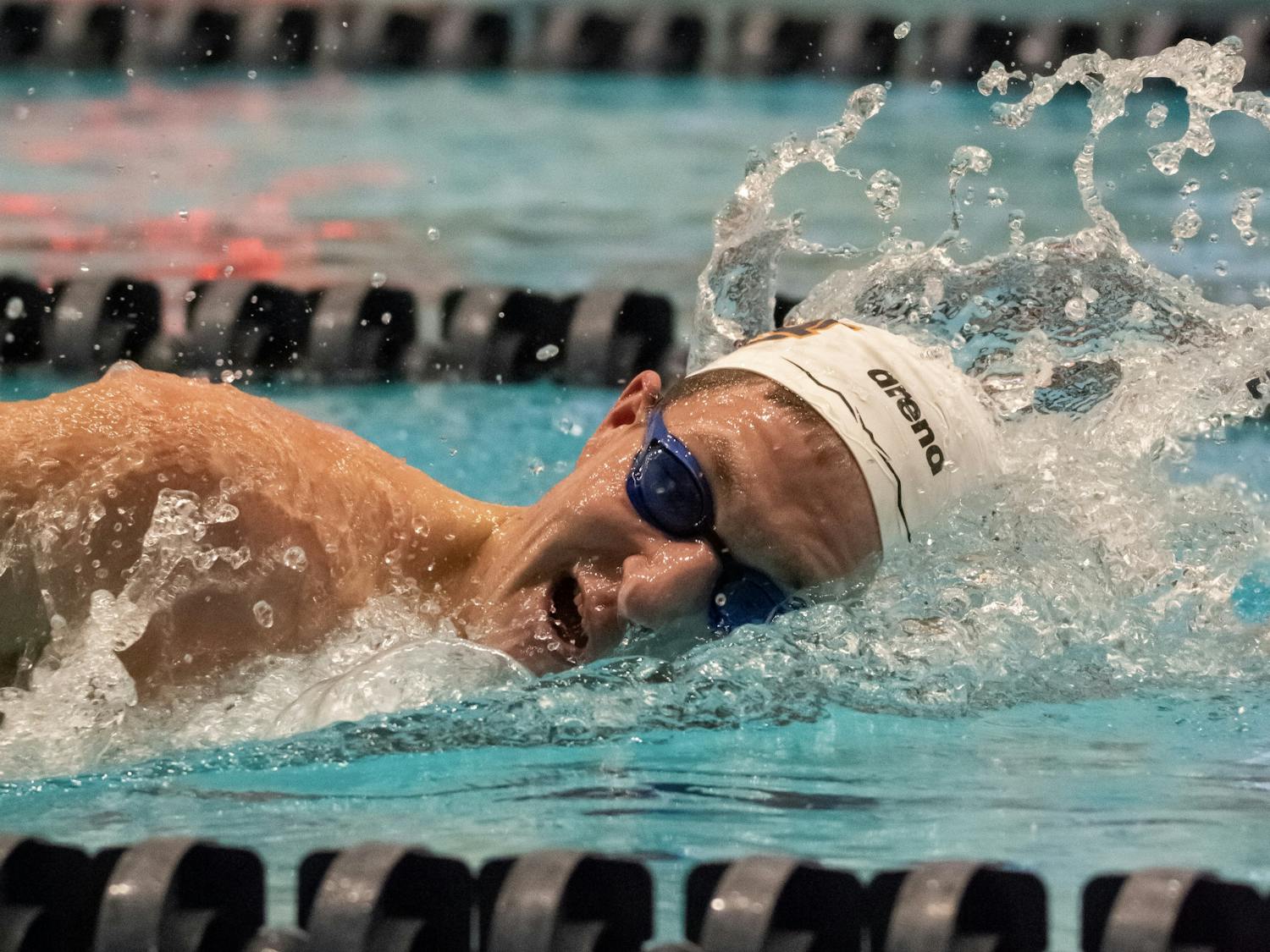 An Auburn swimmer competes in a freestyle event at the James E. Martin Aquatic Center on Feb. 4, 2023.