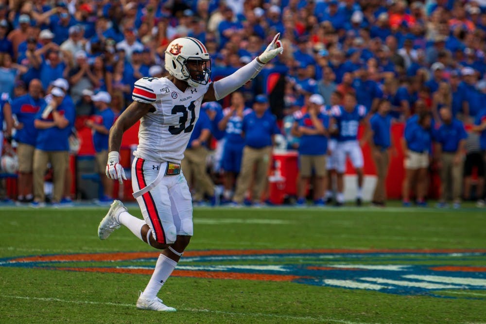 <p>Chandler Wooten (31) runs off the field celebrating a play during Auburn vs. Florida, on Saturday, Oct. 5, 2019, in Gainesville, Fla.</p>