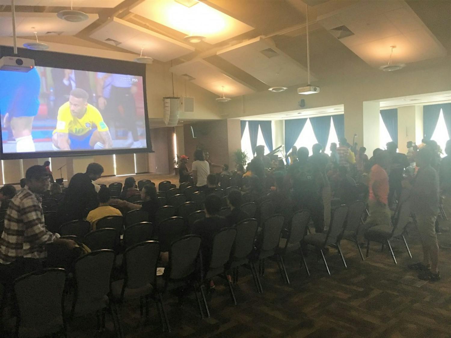 A crowd of students watches the Brazil- Belgium quarter-final match of the Fifa World Cup in the Student Center Ballroom on Friday, July 6, 2018, in Auburn, Ala. 