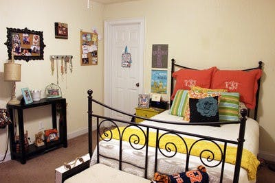Victoria Beasley decorates her room at Eagle's Landing on Longleaf  Drive to fit her style.