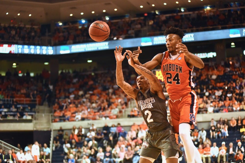 Anfernee McLemore (24) jumps to catch the ball during Auburn Men's Basketball vs. Mississippi State on March 2, 2019, in Auburn, Ala.