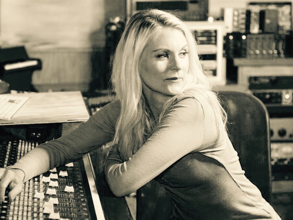 Voice actress and Auburn alumna Kate Higgins sits in a recording studio.&nbsp;