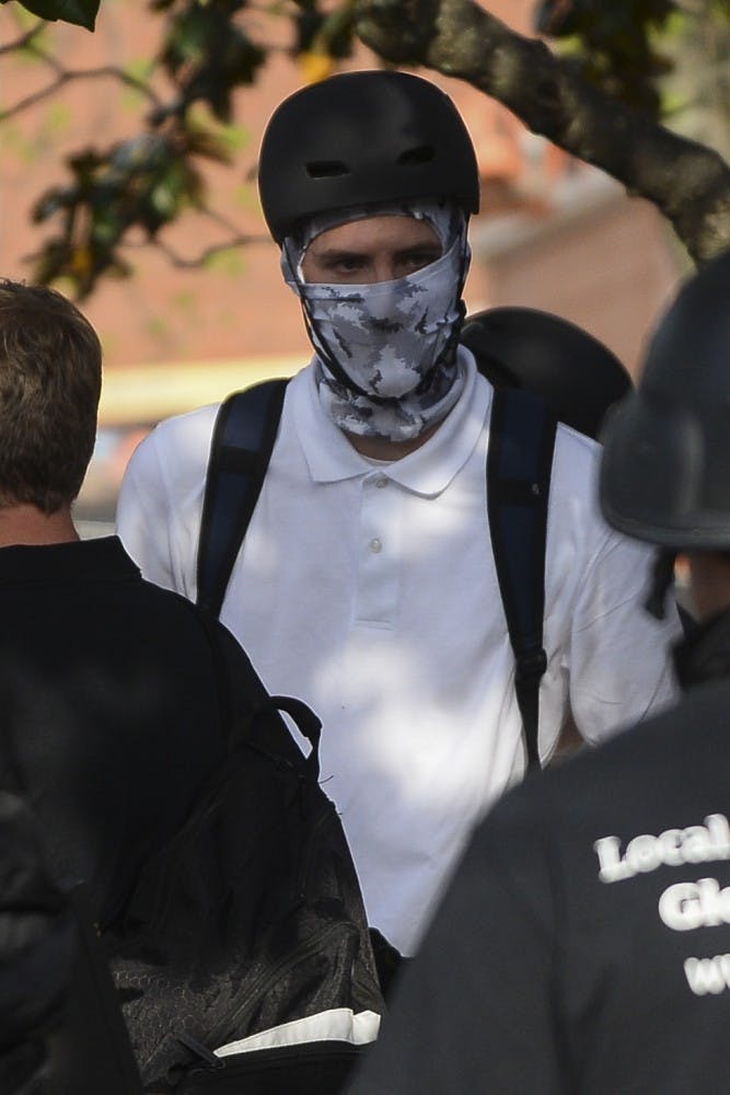Alt-right protestors talk before Richard Spencer's event at Foy Hall on Tuesday, April 18, 2017 in Auburn, Ala. 