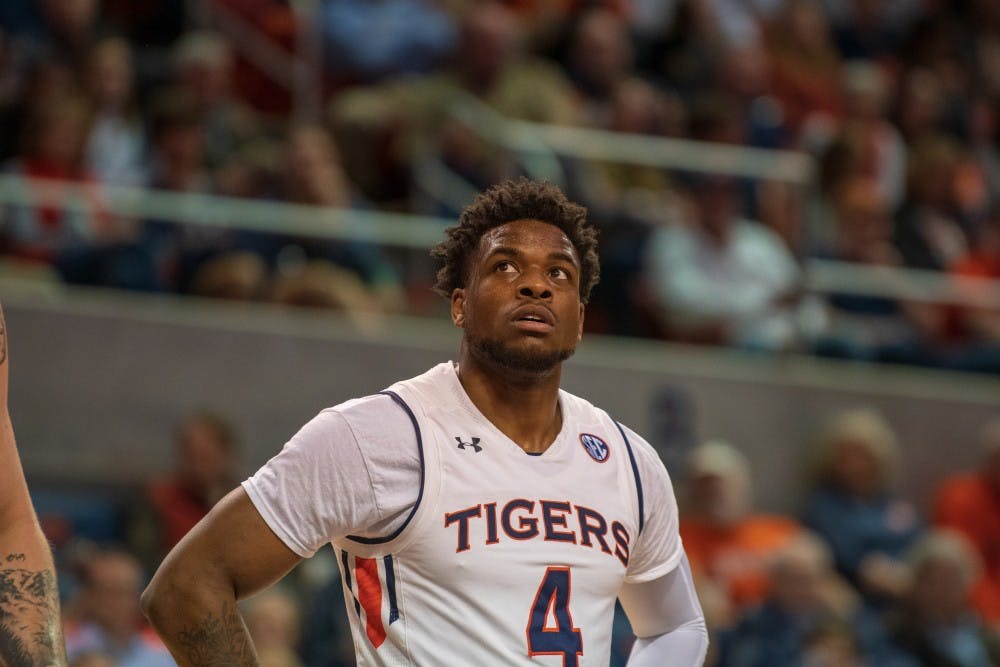 Malik Dunbar (4) looks on during Auburn Men's Basketball vs. Ole Miss, on Wednesday, Feb. 13, 2019, in Auburn, Ala.