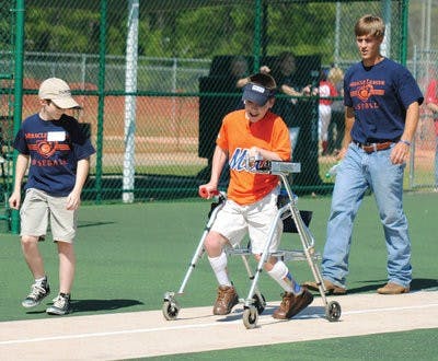 Gunter Nawrocki scores a run for the Mets Sunday at Billy Hitchcock Miracle Field, part of the West Ridge Baseball Complex in Opelika. (Maria Iampietro / Associate Photo Editor)