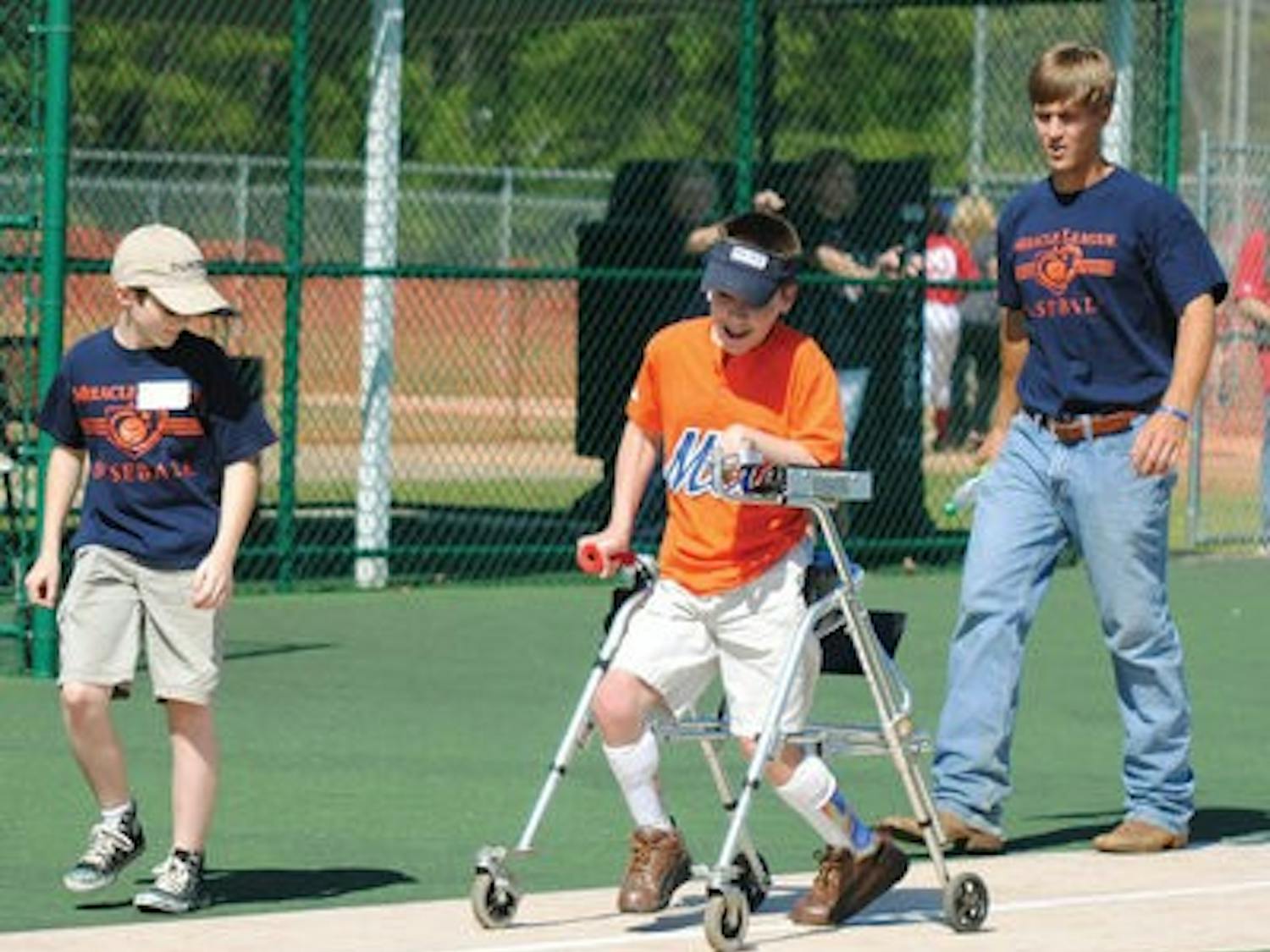 Gunter Nawrocki scores a run for the Mets Sunday at Billy Hitchcock Miracle Field, part of the West Ridge Baseball Complex in Opelika. (Maria Iampietro / Associate Photo Editor)