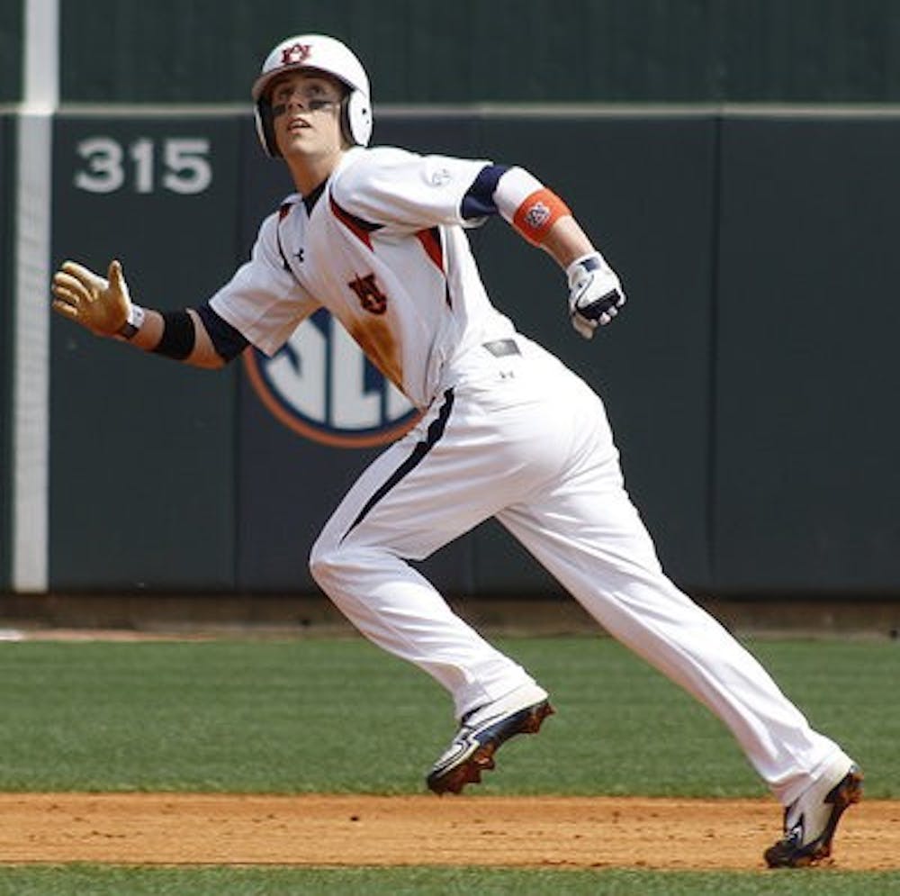 Ryan Tella watches a fly ball as he runs to third base against Belmont March 11. (Courtesy of Missy Hazeldine)