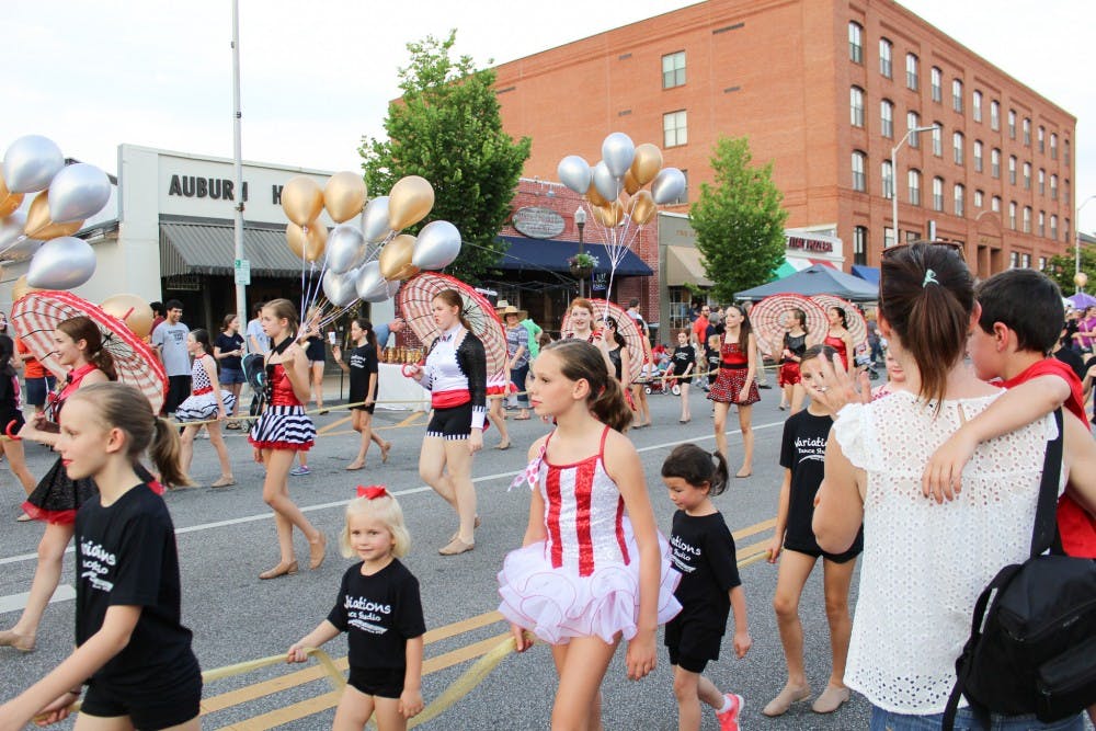 <p>The parade converging at Toomer's Corner at&nbsp;Summernight Downtown Art Walk on Friday, June 8, 2018, in Auburn, Ala.</p>