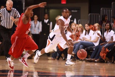 Sophomore guard Josh Wallace races past a Columbus State defender Monday night. Auburn fell to the Cougars 54-52. (Emily Adams / Photo Editor)