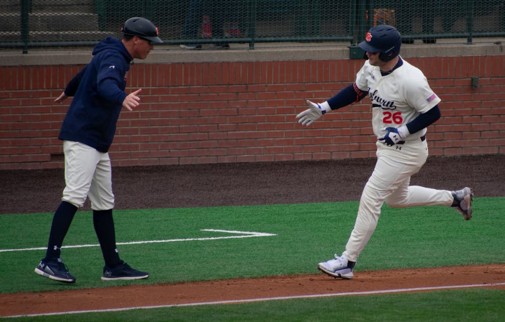 <p>Auburn first baseman Cooper McMurray rounding out the bases after a home run in the game against Eastern Kentucky on Feb 17, 2024.&nbsp;</p>