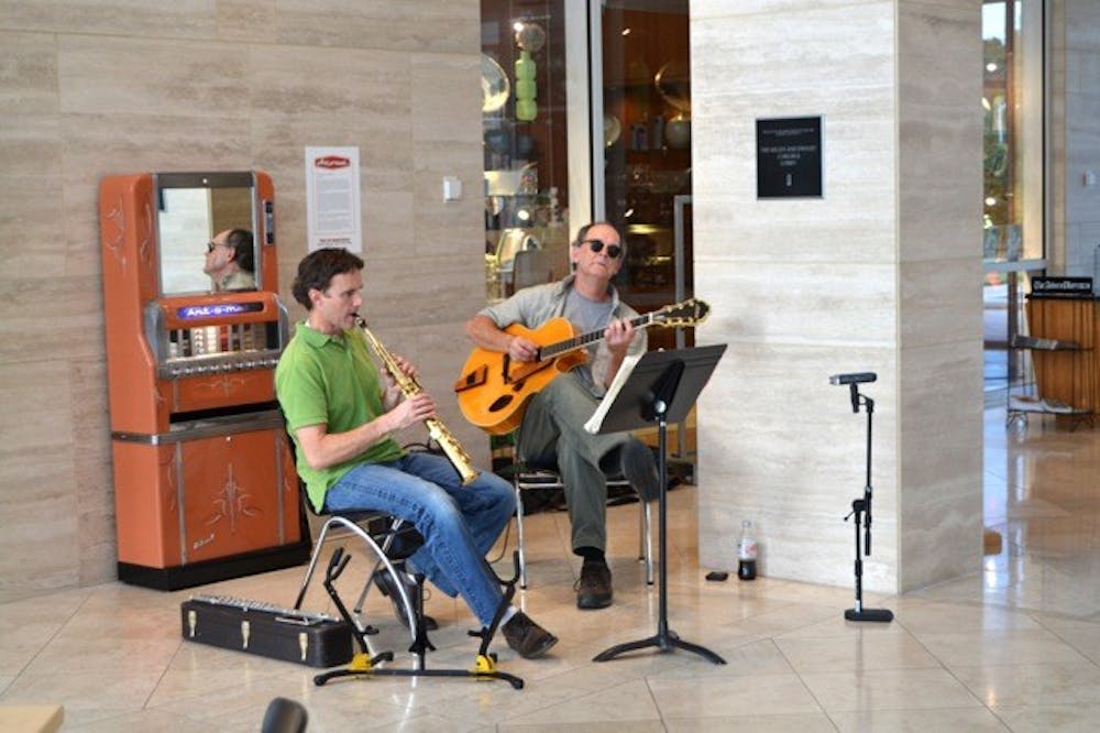 <p>Cullars Improvisation Rotation's Patrick McCurry and Dan Macowski play jazz in the Jules Collins Smith Museum of Fine Art as part of Jazz! Food! Art! on Sept. 3. (Christy Stipe | Photographer) </p>