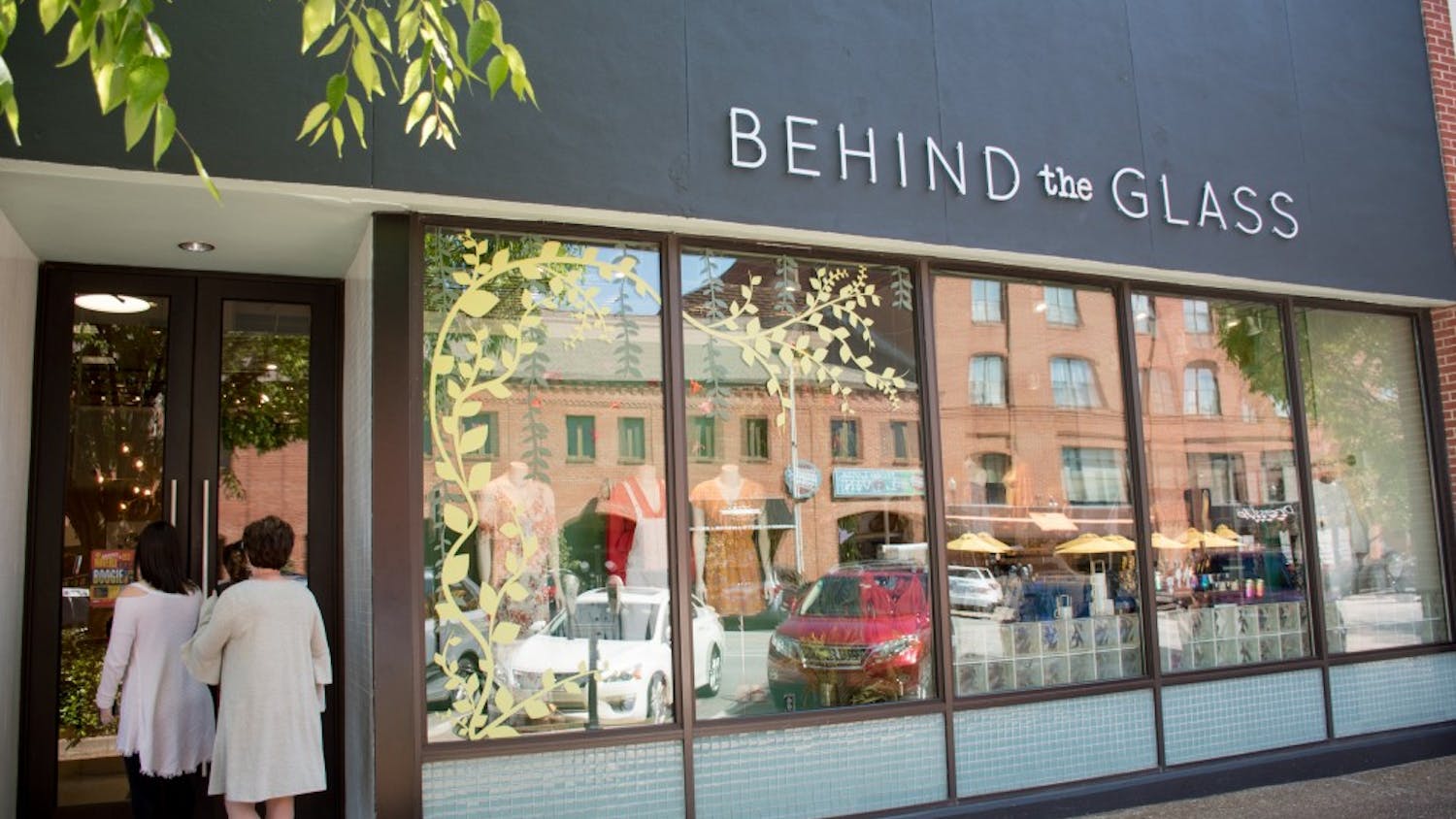 People walk in Behind the Glass on Sunday, April 8, 2018, in Auburn, Ala.