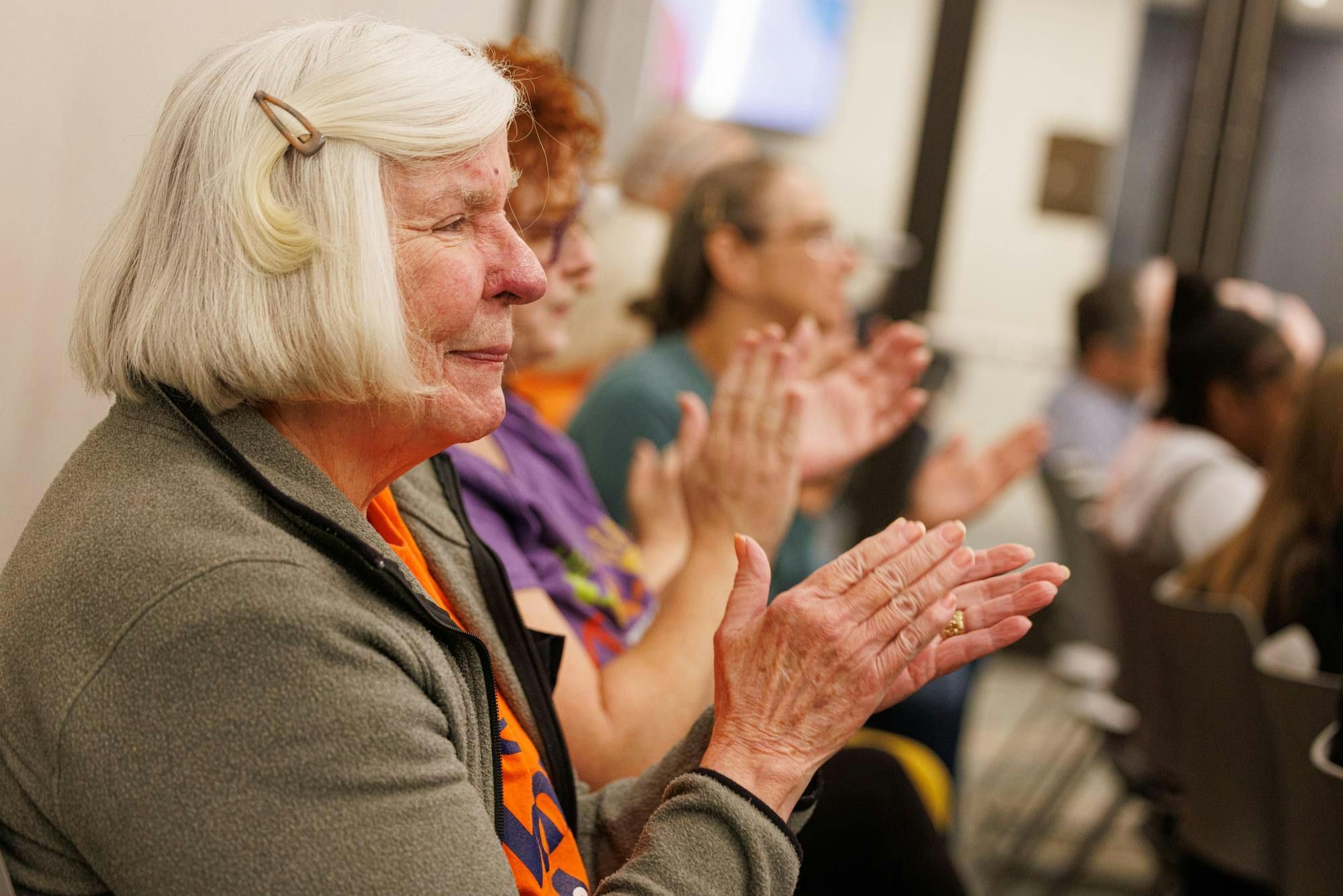 Attendees clap during Congressional candidate Lee McInnis' open meeting in Opelika, Alabama on Nov. 19, 2025.