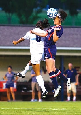 Sophomore forward Casie Ramsier plays a header against UC Irvine on August 29, 2014.
