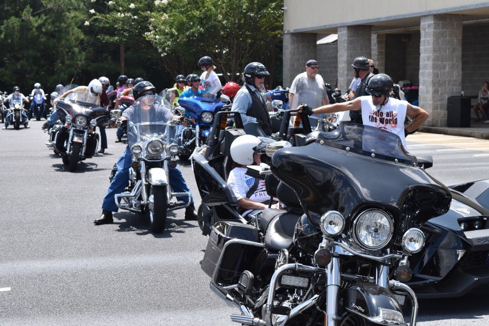 Riders contributing donations to the Lee County Humane Society line up for the&nbsp;ride to begin.