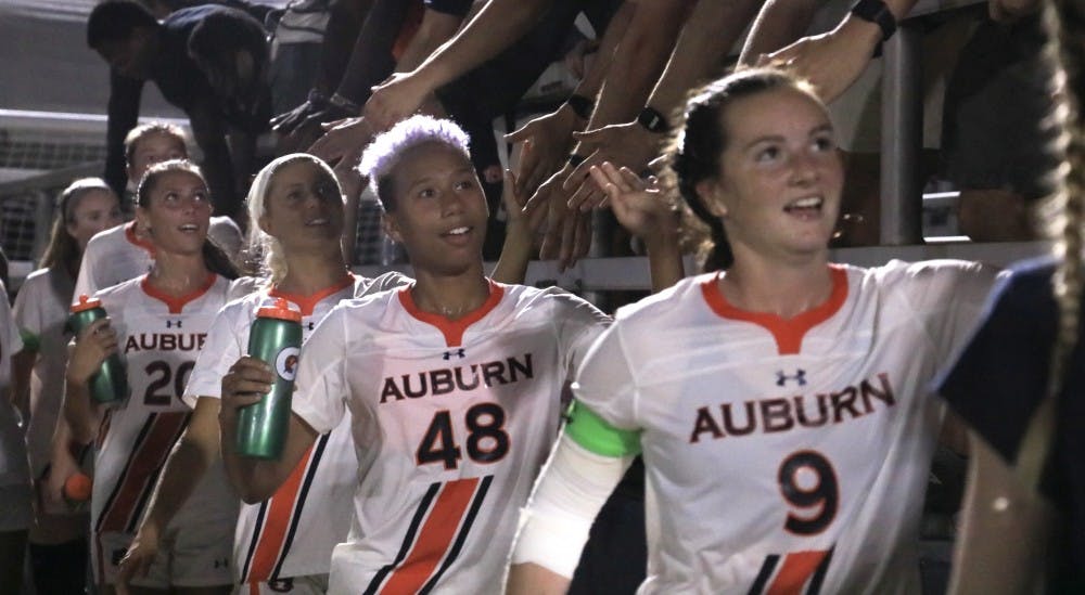 <p>Auburn's Jaelyn Gadson (48) and Jessie Gerow (9) celebrate their win over Tennessee on Sept. 26, 2019, in Auburn, Ala.</p>