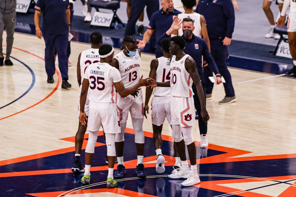 Mar 6, 2021; Auburn, AL, USA; The team reacts after a big play during the game between Auburn and Mississippi State at Auburn Arena. Mandatory Credit: Jacob Taylor/AU Athletics