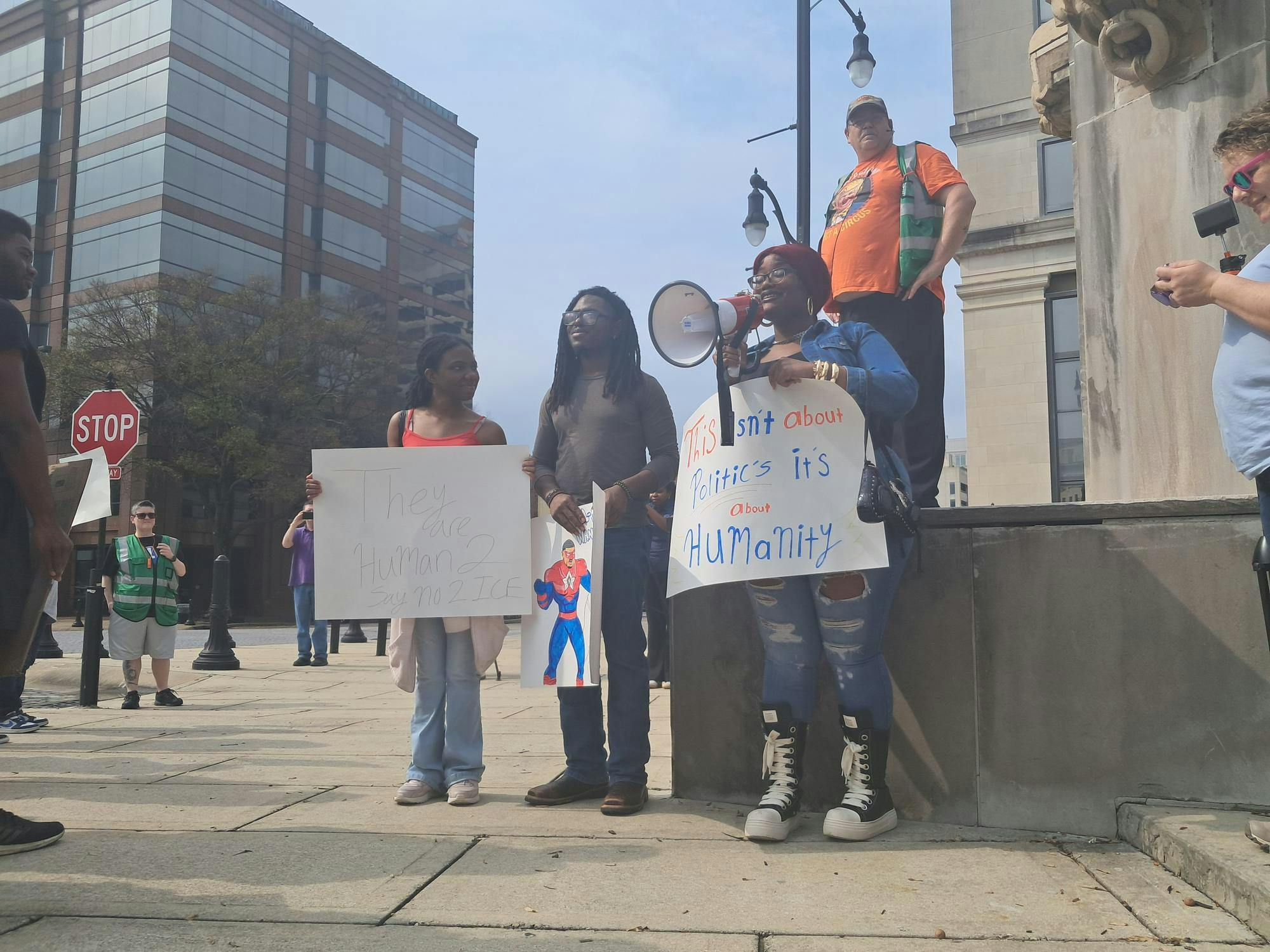 Seania Player (left), Ronny Martin (middle) and Lillian Speigner (right) speak at the "Say No 2 ICE" march on Feb. 21, 2026.