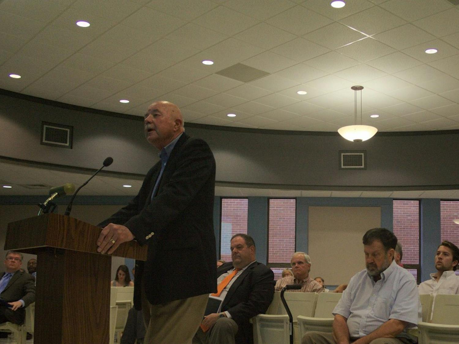 Daniel Bennett, dean and professor emeritus of Auburn's College of Architecture, delivers a presentation at Auburn City Council on July 20, 2016.