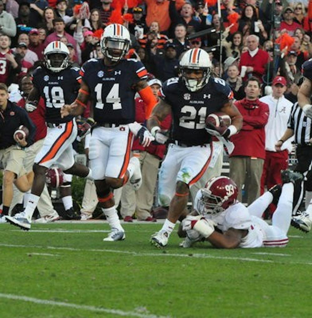 Tre Mason carries the ball up the field against Alabama. (Anna Grafton / PHOTO EDITOR)