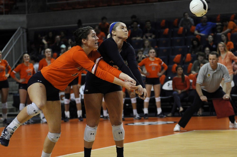<p>Brenna McIlroy (8) and Jesse Earl (3) go for the ball during Auburn Volleyball vs. Alabama on Wednesday, Nov. 1, 2017 in Auburn, Ala.</p>