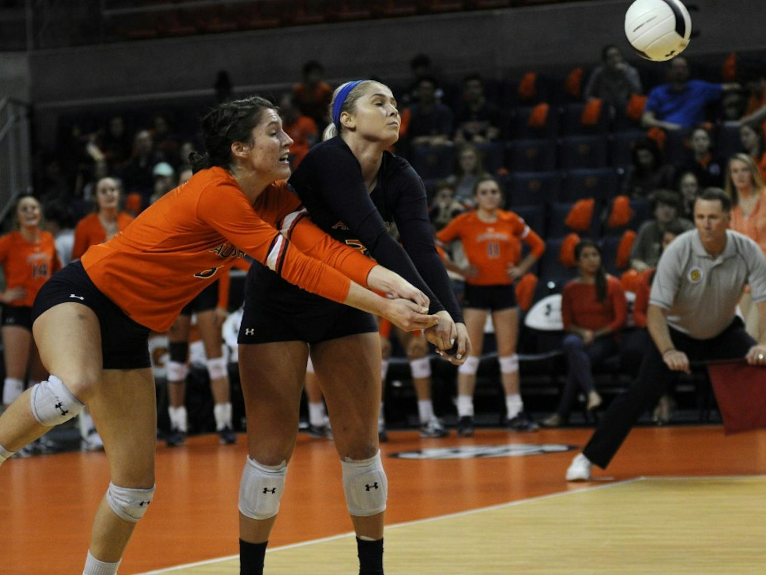 Brenna McIlroy (8) and Jesse Earl (3) go for the ball during Auburn Volleyball vs. Alabama on Wednesday, Nov. 1, 2017 in Auburn, Ala.