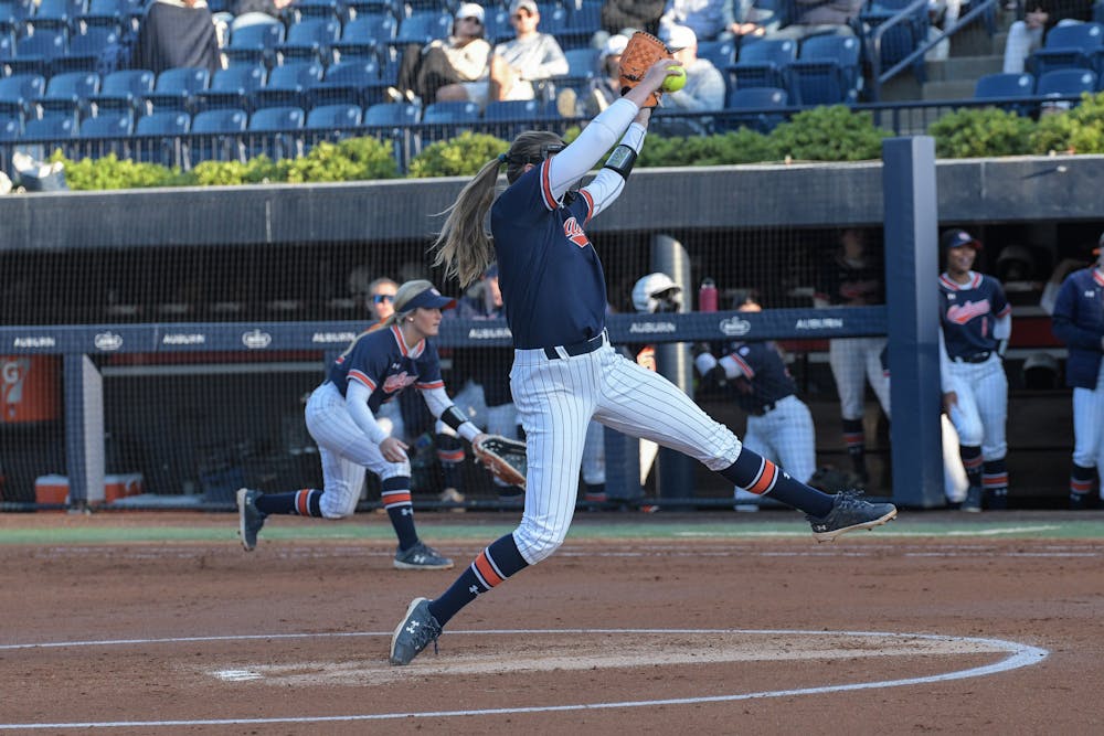 <p>Maddie Penta (#9) for Auburn pitches against Kentucky University.</p>