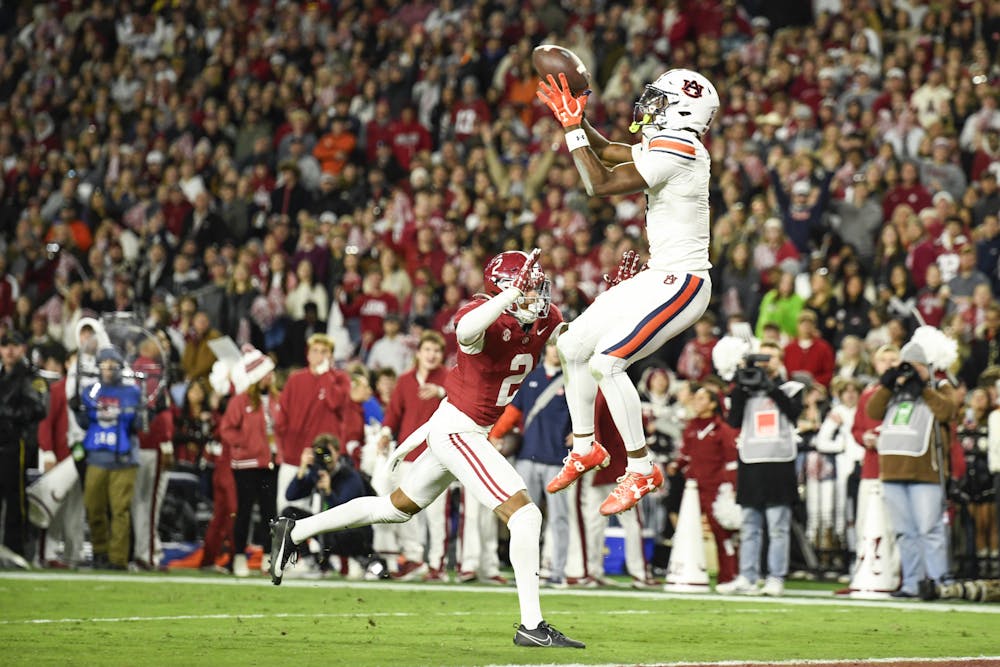 Auburn Wide Receiver Cam Coleman (8) catches a touchdown pass during a matchup between Auburn and Alabama in Bryant-Denny Stadium on Nov. 30, 2024.