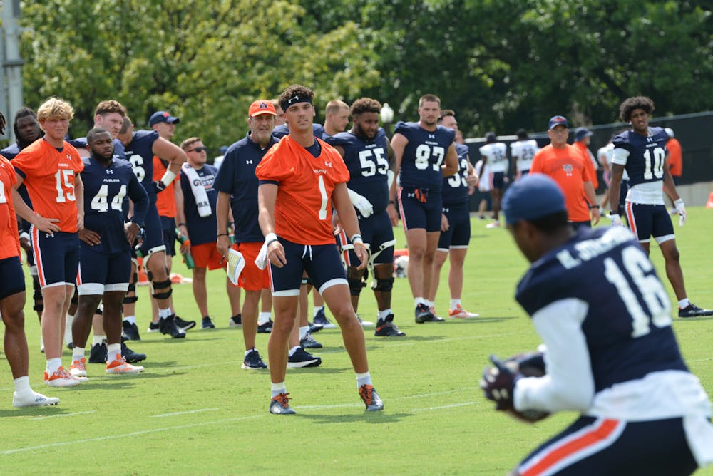 <p>Payton Thorne (1) throws a pass at Auburn's football practice at the Woltosz Football Performance Center on Aug. 4, 2023.</p>