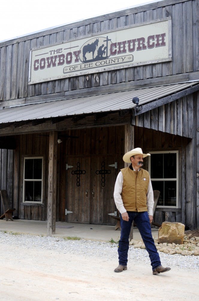 Head pastor Jim Strickland stands in front of the Cowboy Church on April 22, in Waverly, Ala.&nbsp;