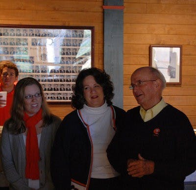 Tom Eden, SAE alumnus and former Auburn cheerleader, stands with his family at the SAE house for the dedication of the dining hall in his honor. (Charlie Timberlake / assistant photo editor)