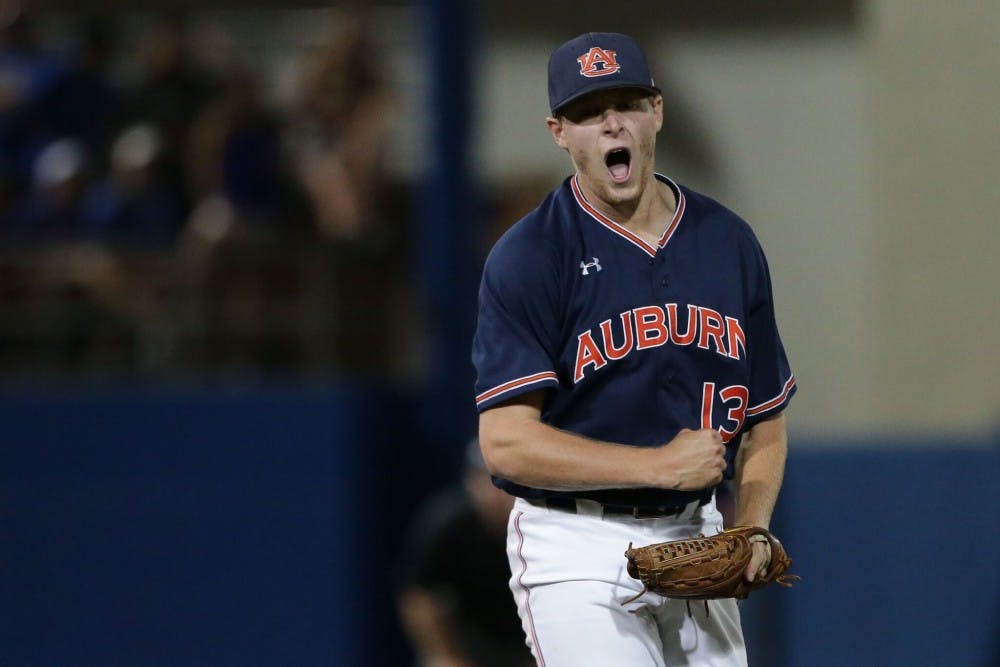 Davis Daniel (13) celebrates a strikeout during Auburn Baseball's Super Regional vs. Florida on June 11, 2018, in Gainesville, Fla.&nbsp;