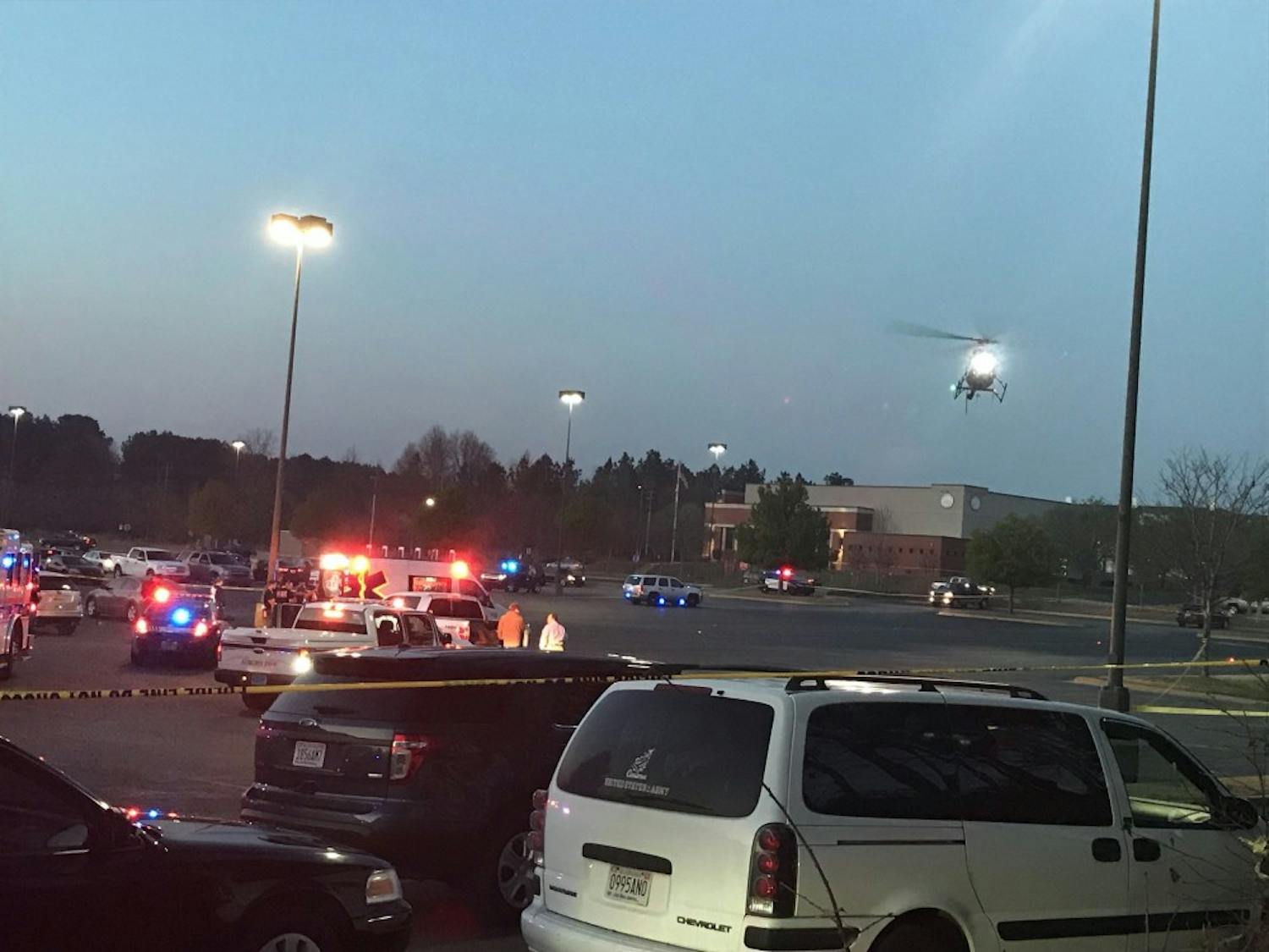 A life-flight helicopter lands on the scene of a reported shooting at Auburn Mall.